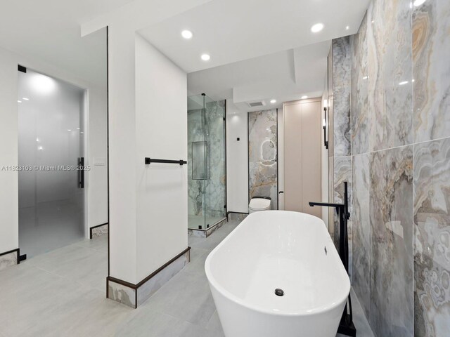 700 Coral Way Unit 5, Coral Gables, FL 33134 - full bath featuring a freestanding bath, a marble finish shower, tile walls, and recessed lighting