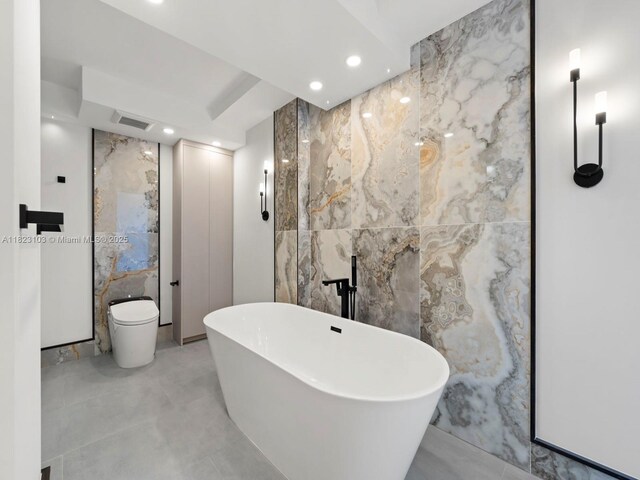 700 Coral Way Unit 5, Coral Gables, FL 33134 - full bath with tile walls, a soaking tub, recessed lighting, and stone wall