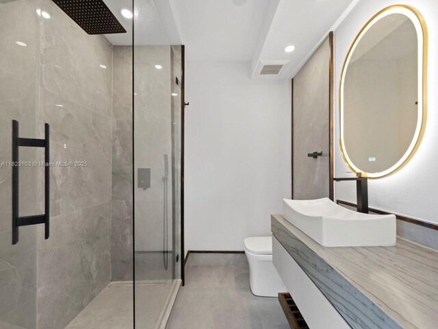700 Coral Way Unit 5, Coral Gables, FL 33134 - bathroom featuring a shower stall, vanity, and recessed lighting