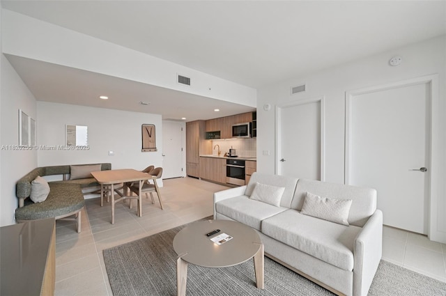 159 NE 6th St Unit 4409, Miami, FL 33132 - living area with light tile patterned floors and recessed lighting