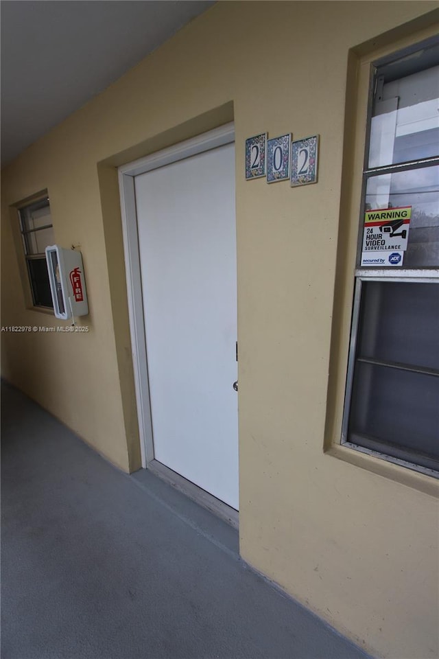 427 Santander Ave Unit 202, Coral Gables, FL 33134 - view of exterior entry with stucco siding