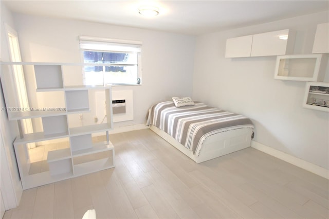 427 Santander Ave Unit 202, Coral Gables, FL 33134 - unfurnished bedroom featuring wood finished floors and baseboards