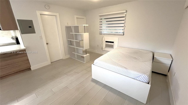 427 Santander Ave Unit 202, Coral Gables, FL 33134 - bedroom with electric panel, light wood-type flooring, and an AC wall unit
