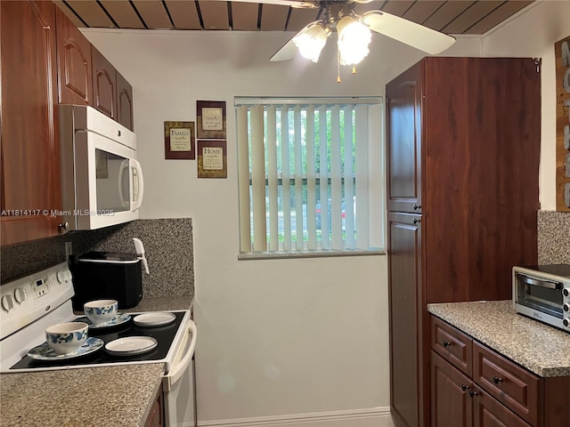 8605 W Sample Rd Unit 101, Coral Springs, FL 33065 - kitchen with white appliances and ceiling fan
