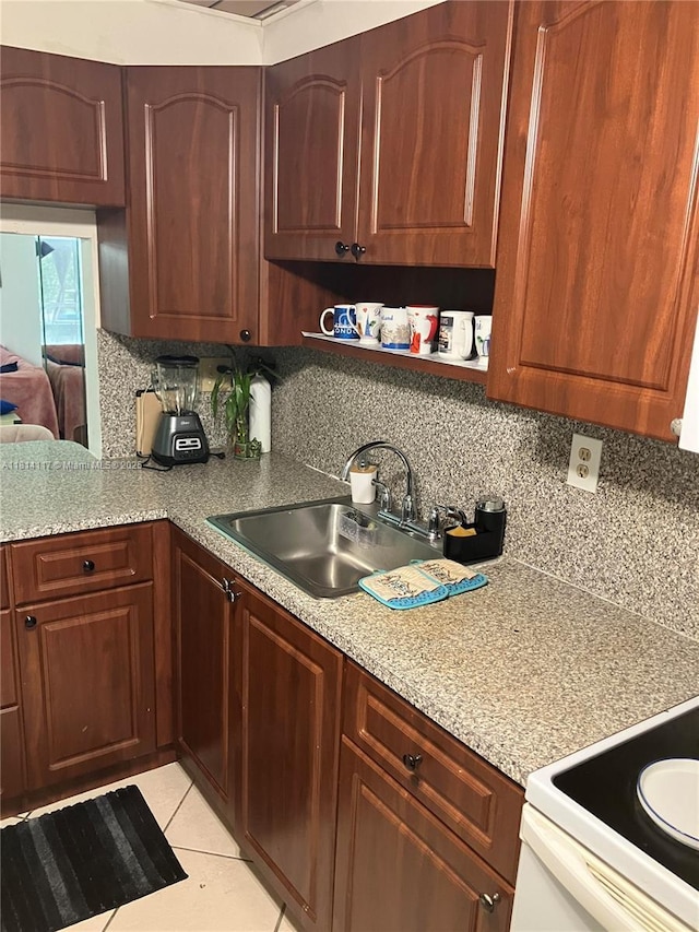 8605 W Sample Rd Unit 101, Coral Springs, FL 33065 - kitchen with tasteful backsplash, light countertops, light tile patterned floors, and white range with electric stovetop