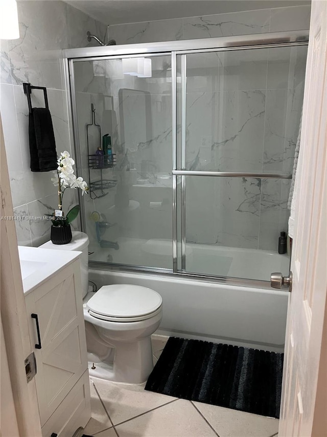 8605 W Sample Rd Unit 101, Coral Springs, FL 33065 - bathroom featuring shower / bath combination with glass door, vanity, and tile walls