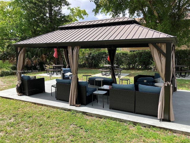 8605 W Sample Rd Unit 101, Coral Springs, FL 33065 - view of community featuring a gazebo, outdoor lounge area, a patio area, and a lawn