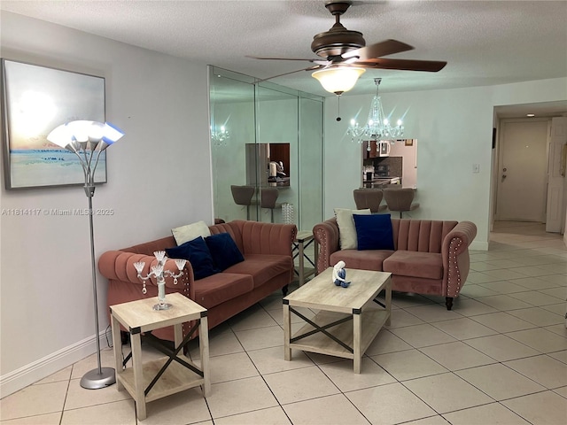8605 W Sample Rd Unit 101, Coral Springs, FL 33065 - living room featuring a ceiling fan, light tile patterned flooring, a chandelier, and a textured ceiling