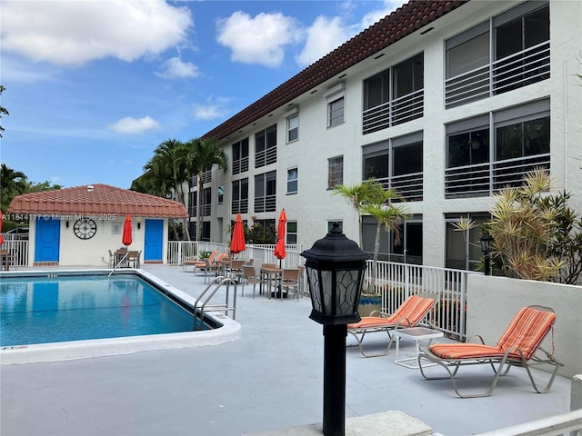 8605 W Sample Rd Unit 101, Coral Springs, FL 33065 - community pool featuring a patio