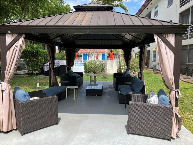 8605 W Sample Rd Unit 101, Coral Springs, FL 33065 - view of patio / terrace featuring a gazebo, an outdoor living space, and grilling area