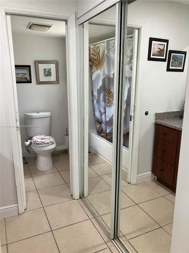 8605 W Sample Rd Unit 101, Coral Springs, FL 33065 - bathroom featuring vanity, shower / bath combo, and tile patterned floors