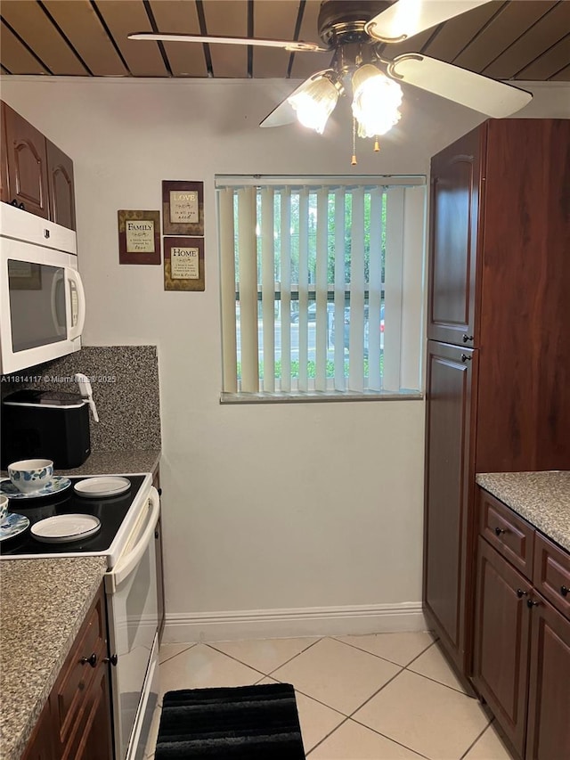 8605 W Sample Rd Unit 101, Coral Springs, FL 33065 - kitchen featuring white appliances, light tile patterned floors, a ceiling fan, and light stone counters