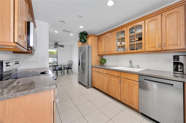 8861 SW 85th St, Miami, FL 33173 - kitchen featuring stainless steel appliances, backsplash, ceiling fan, recessed lighting, and glass insert cabinets