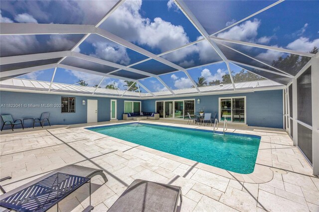 8861 SW 85th St, Miami, FL 33173 - outdoor pool with an outdoor living space, a patio area, and glass enclosure