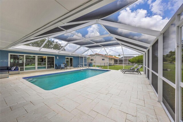 8861 SW 85th St, Miami, FL 33173 - swimming pool featuring a patio area and glass enclosure