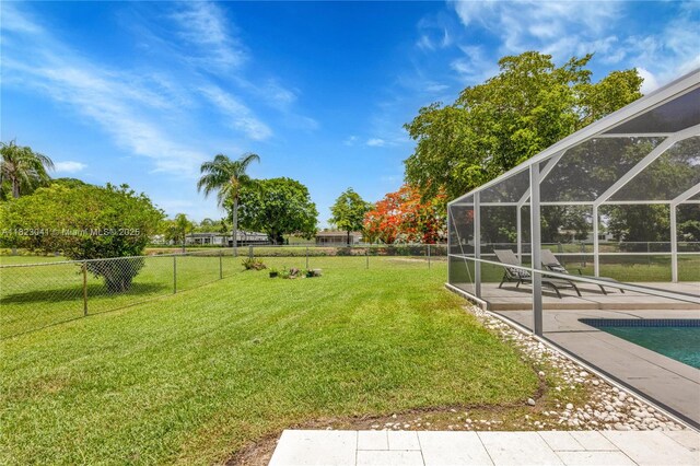 8861 SW 85th St, Miami, FL 33173 - view of yard featuring a patio area and glass enclosure