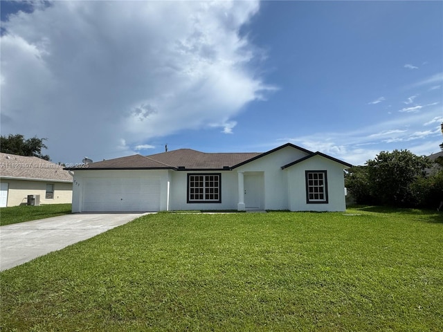 737 SE Brookedge Ave, Port St Lucie, FL 34983 - single story home featuring stucco siding, driveway, a front yard, and a garage