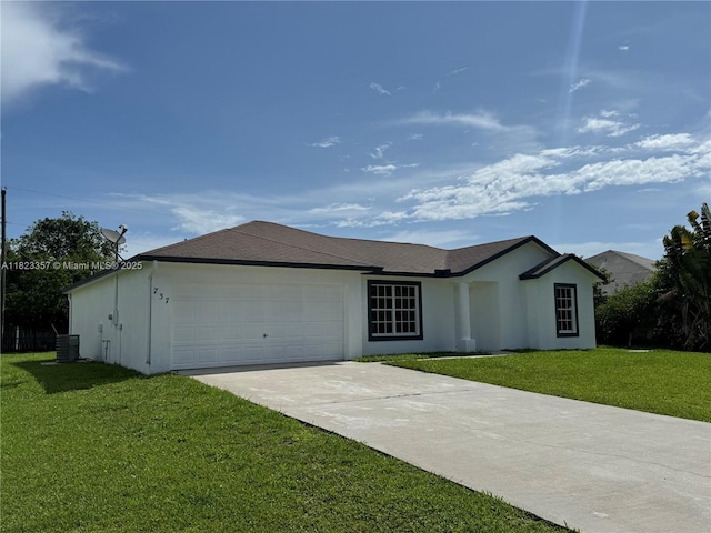 737 SE Brookedge Ave, Port St Lucie, FL 34983 - single story home with a front yard, an attached garage, driveway, and stucco siding