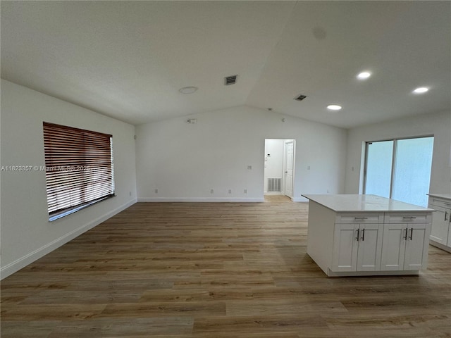 737 SE Brookedge Ave, Port St Lucie, FL 34983 - empty room featuring vaulted ceiling, recessed lighting, and light wood-style floors