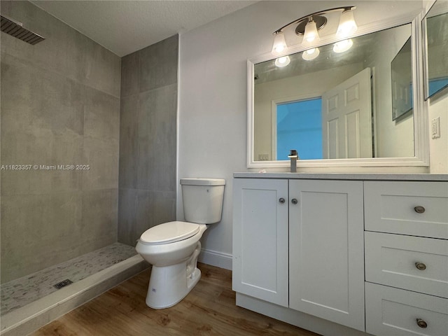 737 SE Brookedge Ave, Port St Lucie, FL 34983 - full bath featuring tiled shower, wood finished floors, and vanity