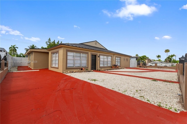 230 W 47th St, Hialeah, FL 33012 - view of front of property featuring stucco siding and a metal roof