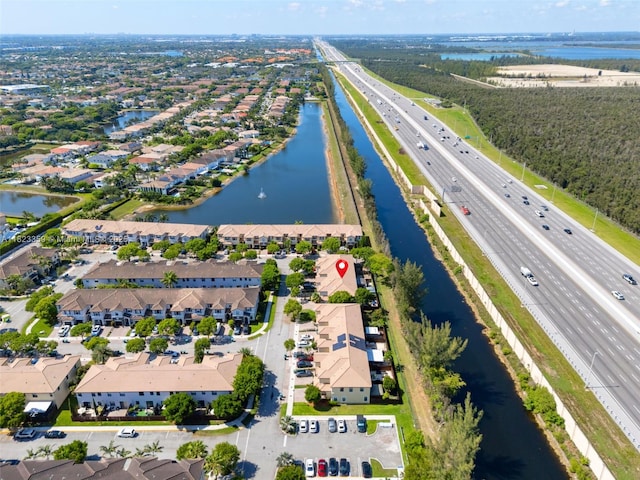 8780 NW 116th Path, Doral, FL 33178 - aerial view of residential area with a highway and a large body of water