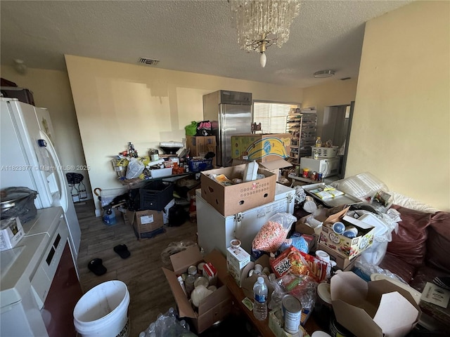 7080 Hope St, Hollywood, FL 33024 - miscellaneous room featuring wood finished floors and a textured ceiling