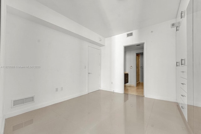 488 NE 18th St Unit 3105, Miami, FL 33132 - tiled spare room featuring baseboards