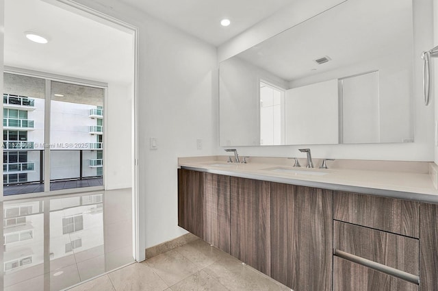 488 NE 18th St Unit 3105, Miami, FL 33132 - bathroom featuring double vanity, tile patterned flooring, and recessed lighting