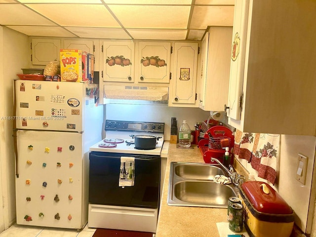1311 NW 43rd Ave Unit 102, Lauderhill, FL 33313 - kitchen featuring under cabinet range hood, electric range, freestanding refrigerator, a drop ceiling, and light countertops