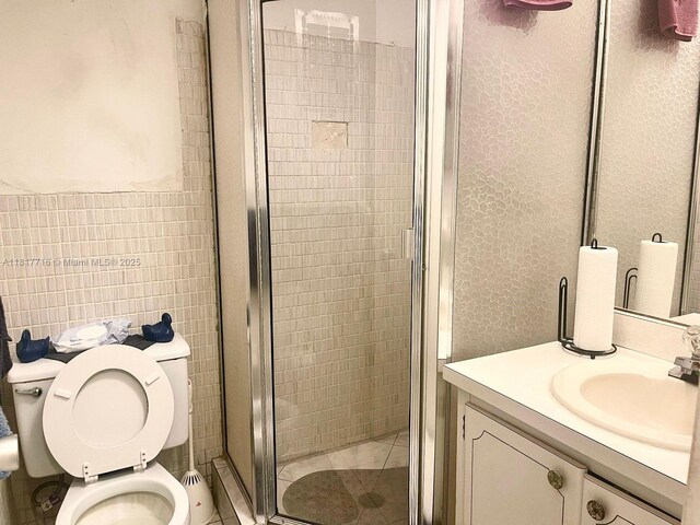 1311 NW 43rd Ave Unit 102, Lauderhill, FL 33313 - full bathroom with a shower stall, vanity, and tile walls