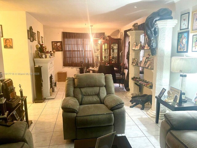 1311 NW 43rd Ave Unit 102, Lauderhill, FL 33313 - living room with light tile patterned floors and a fireplace with raised hearth