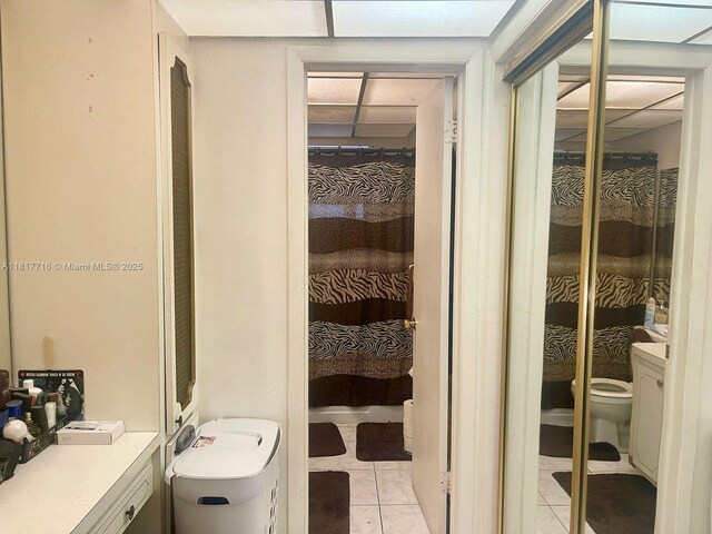 1311 NW 43rd Ave Unit 102, Lauderhill, FL 33313 - full bath featuring toilet and tile patterned flooring