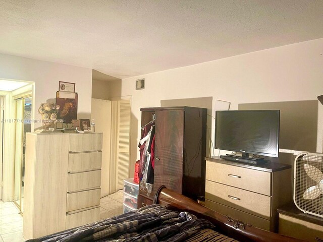1311 NW 43rd Ave Unit 102, Lauderhill, FL 33313 - bedroom with light tile patterned floors