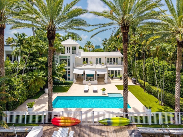 1839 W 24th St, Miami Beach, FL 33140 - back of house with a balcony, a patio, and stucco siding