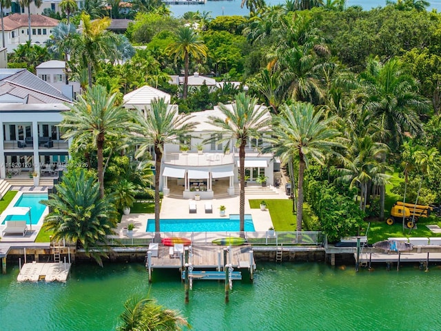 1839 W 24th St, Miami Beach, FL 33140 - back of house featuring a balcony, a patio area, an outdoor pool, and a water view