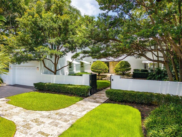 1839 W 24th St, Miami Beach, FL 33140 - fenced yard featuring driveway