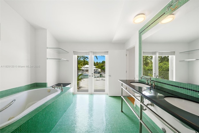 1839 W 24th St, Miami Beach, FL 33140 - bathroom with french doors, healthy amount of natural light, double vanity, and a bath