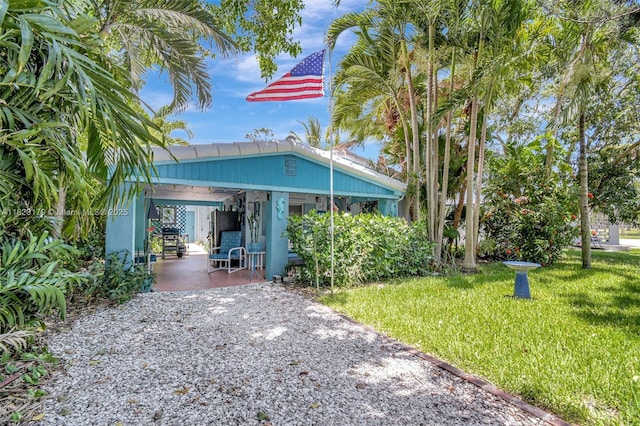 1991 NE 178th St, North Miami Beach, FL 33162 - view of front of property featuring a front lawn