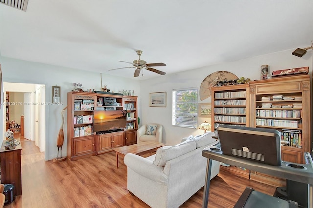 1991 NE 178th St, North Miami Beach, FL 33162 - living area with a ceiling fan, light wood finished floors, and an office area