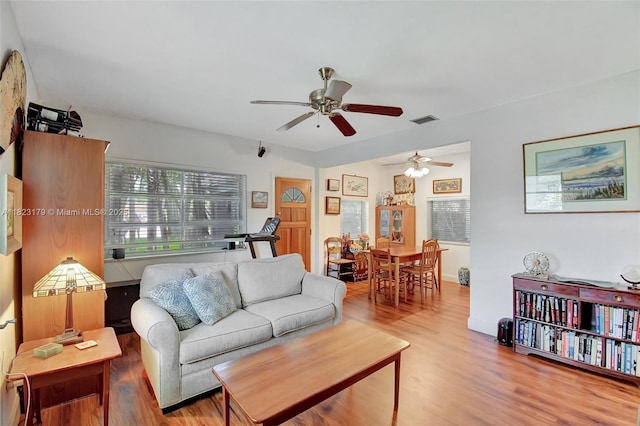 1991 NE 178th St, North Miami Beach, FL 33162 - living area featuring a ceiling fan and wood finished floors