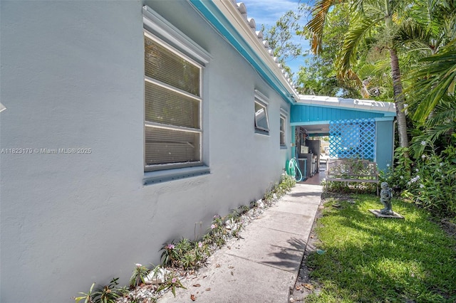 1991 NE 178th St, North Miami Beach, FL 33162 - view of side of property with stucco siding