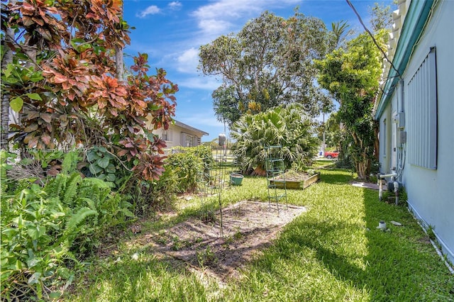 1991 NE 178th St, North Miami Beach, FL 33162 - view of grassy yard featuring a vegetable garden