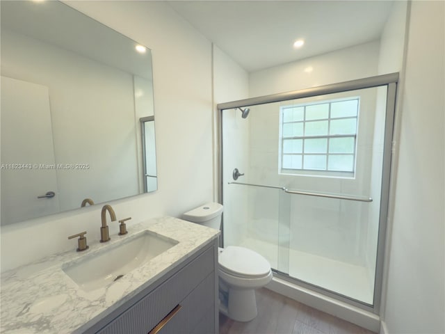 8390 SW 94th St, Miami, FL 33156 - bathroom with vanity, a stall shower, wood finished floors, and recessed lighting
