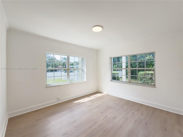 8390 SW 94th St, Miami, FL 33156 - unfurnished room with plenty of natural light, wood finished floors, and crown molding