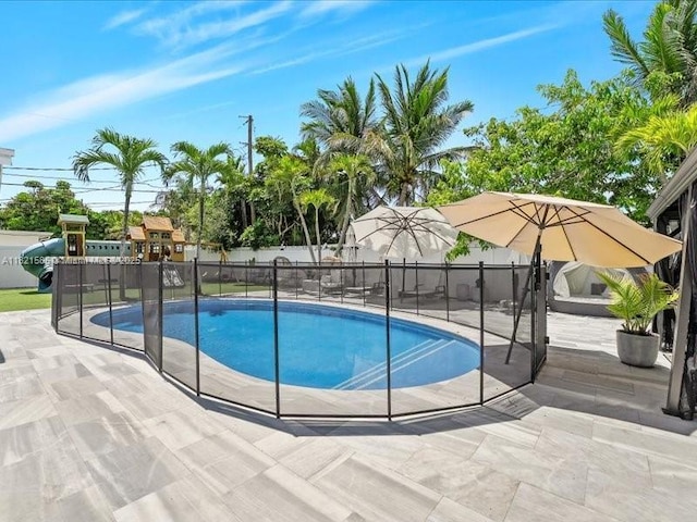 1870 NE 208th Ter, Miami, FL 33179 - view of swimming pool featuring a patio and a playground