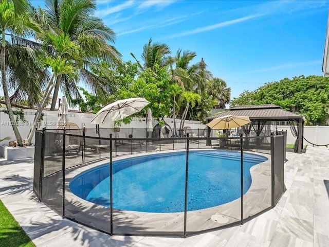 1870 NE 208th Ter, Miami, FL 33179 - view of swimming pool with a gazebo, a fenced backyard, and a patio