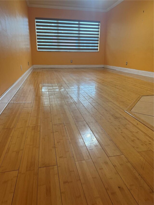 901 NE 3rd St Unit 302, Fort Lauderdale, FL 33301 - empty room with ornamental molding and light wood-style flooring