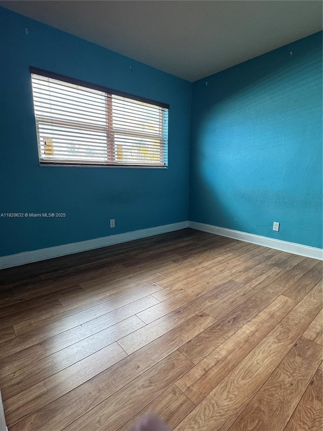 901 NE 3rd St Unit 302, Fort Lauderdale, FL 33301 - empty room featuring wood-type flooring and baseboards