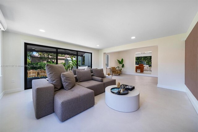 51 NE 110th St, Miami Shores, FL 33161 - living area featuring plenty of natural light, recessed lighting, and concrete flooring